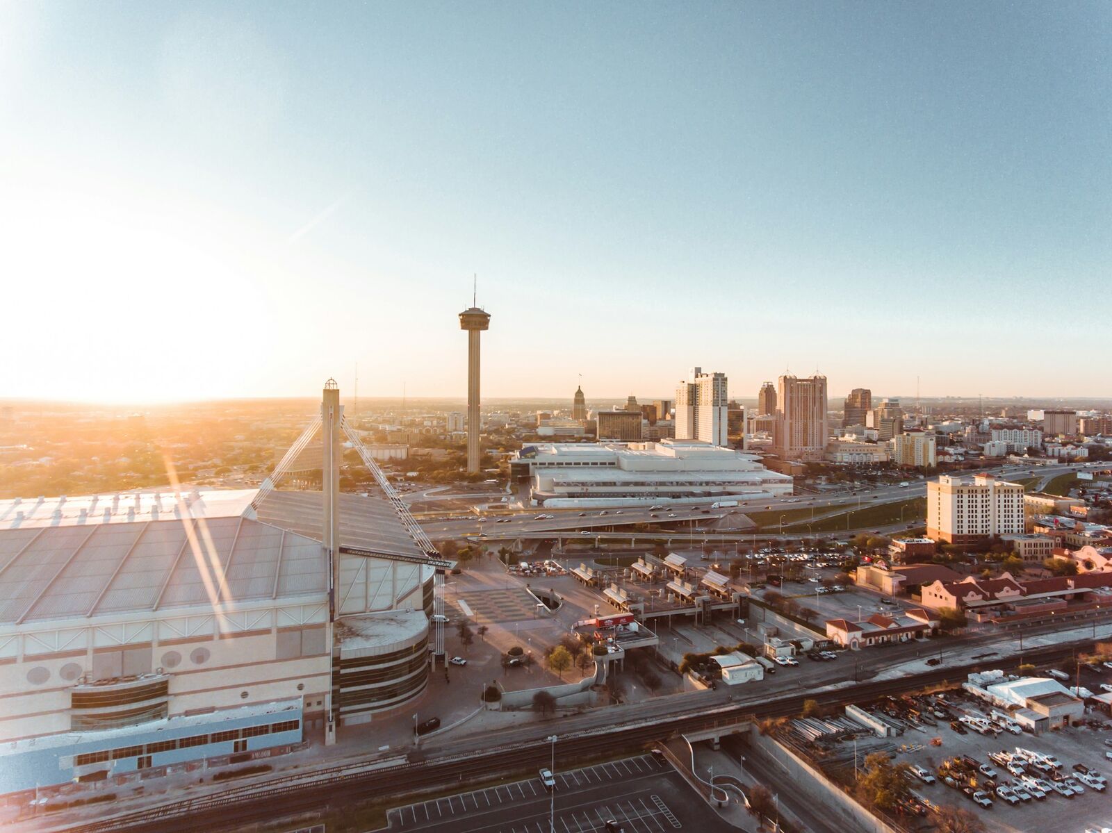 Aerial view of the Alamodome and Tower of the Americas at sunset