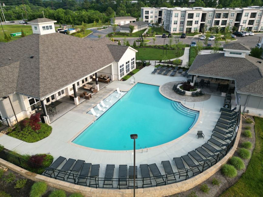 Aerial view of a new apartment community pool and clubhouse
