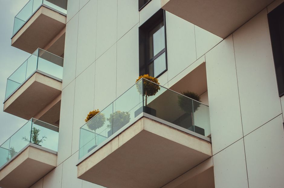 Glass apartment balconies with potted plants
