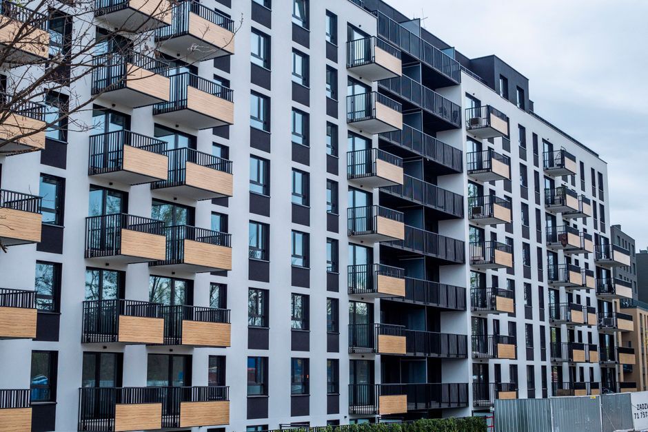Newly built apartment block with wood-paneled balconies