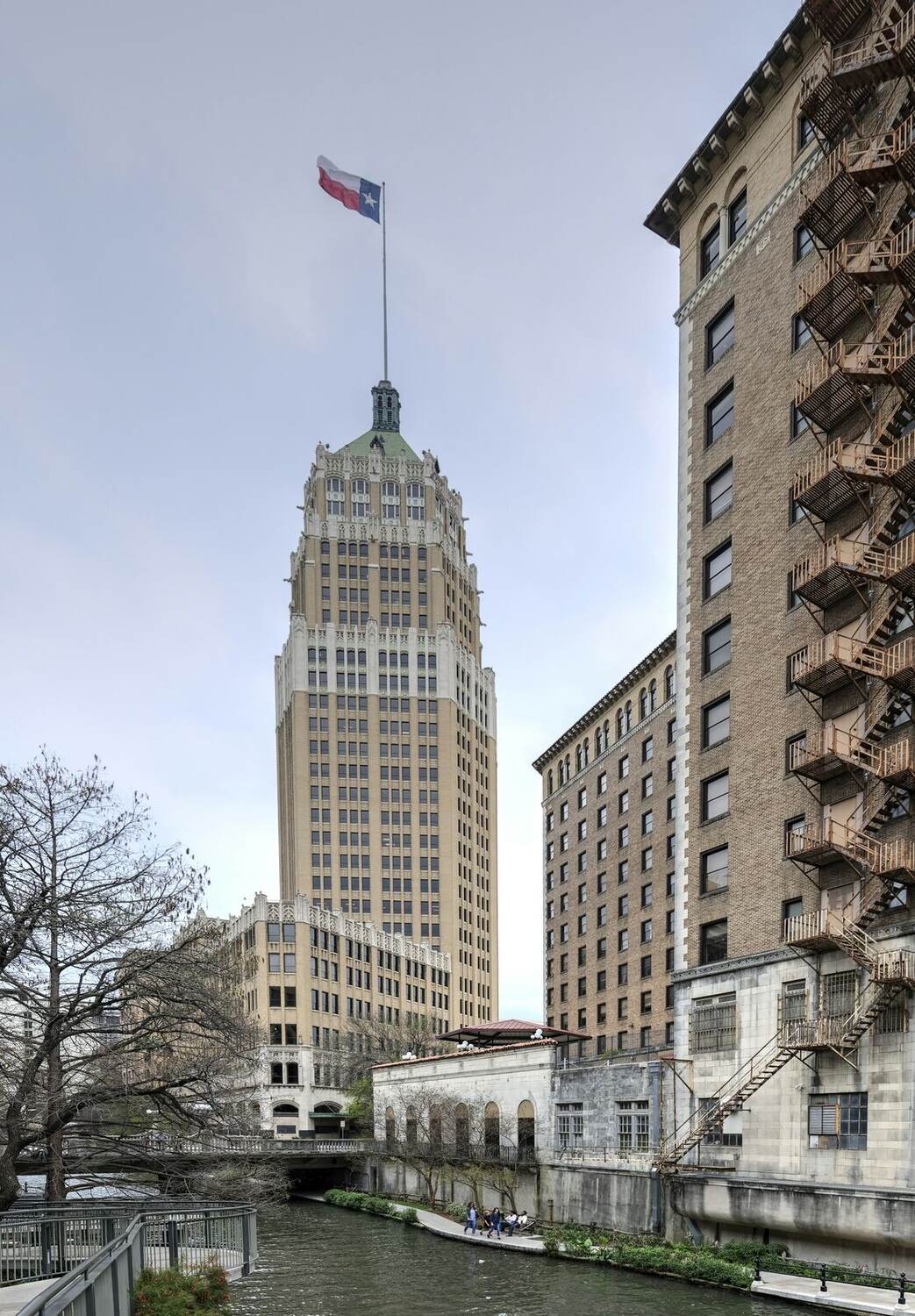 Tower Life Building rising over the San Antonio River